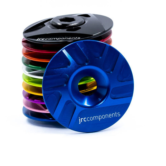 Blue, lightweight, aluminium Ahead stem top cap with sleek pathway design