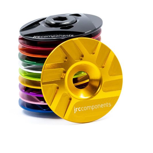 Gold, lightweight, aluminium Ahead stem top cap with sleek pathway design