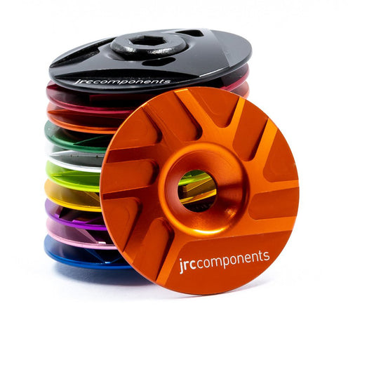 Orange, lightweight, aluminium Ahead stem top cap with sleek pathway design