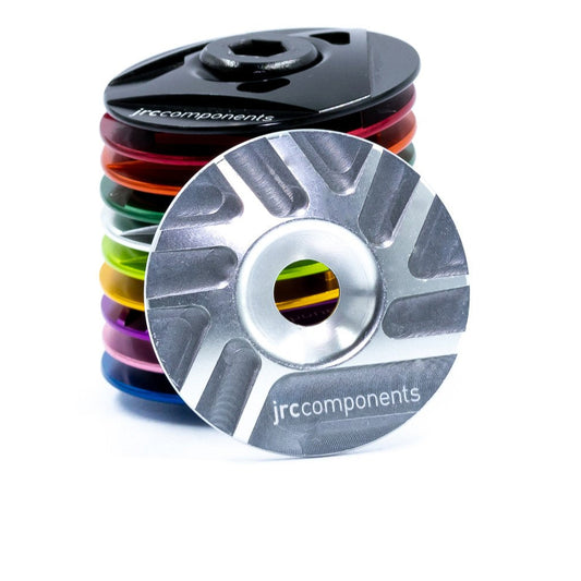 Silver, lightweight, aluminium Ahead stem top cap with sleek pathway design